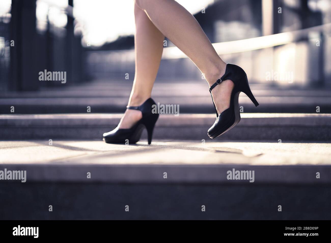 Woman walking in high heels in urban city street in summer. Chic stylish footwear. Elegant fashion style. Business lady with sexy stiletto shoes. Stock Photo