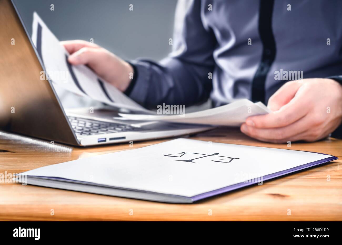Attorney, prosecutor or solicitor working with legal papers in law firm and company. Busy lawyer with brief documents, agreement and contract. Stock Photo