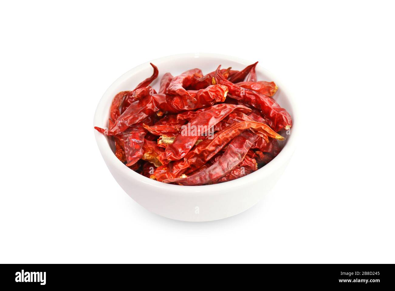 Chili, Chilli red Spicy hot flavor, Dried red chillies in a white cup top view on white background Stock Photo