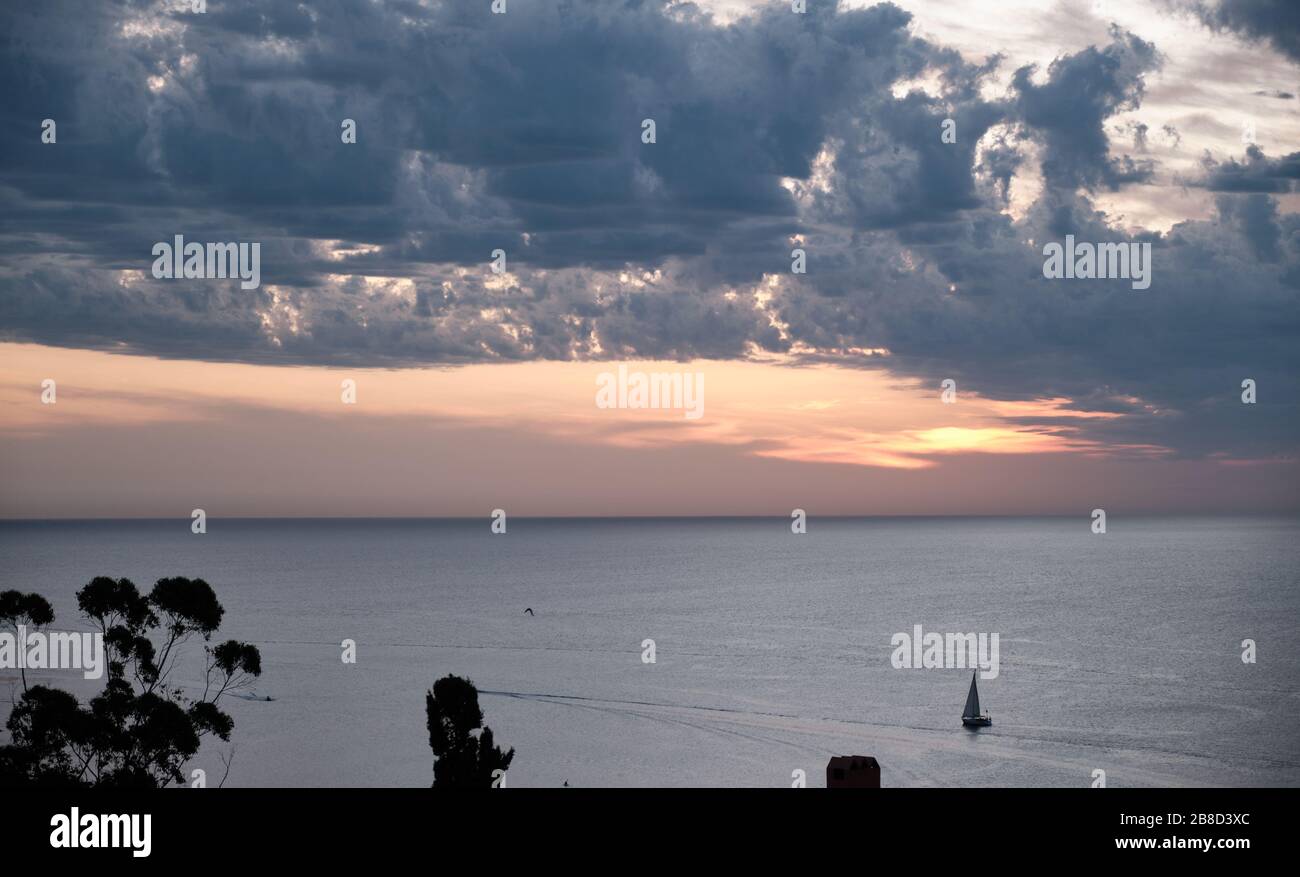 sunset on the sea line horizon of the atlantic sea from Punta Ballena, Maldonado, Uruguay Stock Photo