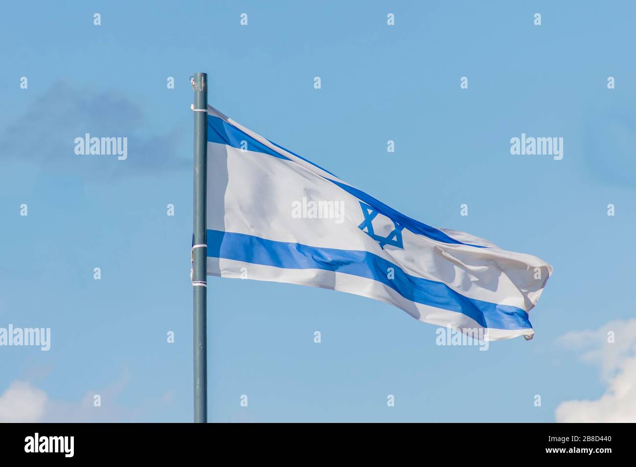 The National flag of Israel flay over the blue sky Stock Photo - Alamy