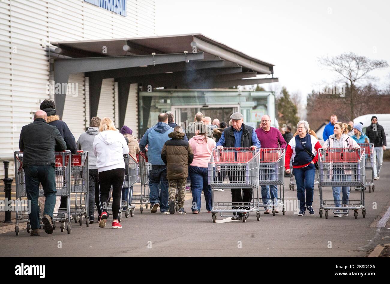 Shoppers queue outside the Costco wholesalers at Straiton, Edinburgh