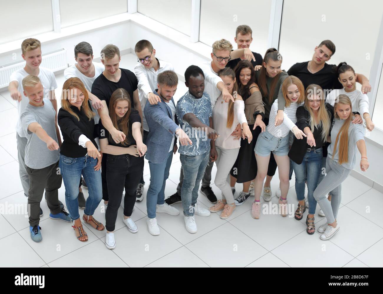 group of diverse young people looking at the camera Stock Photo - Alamy