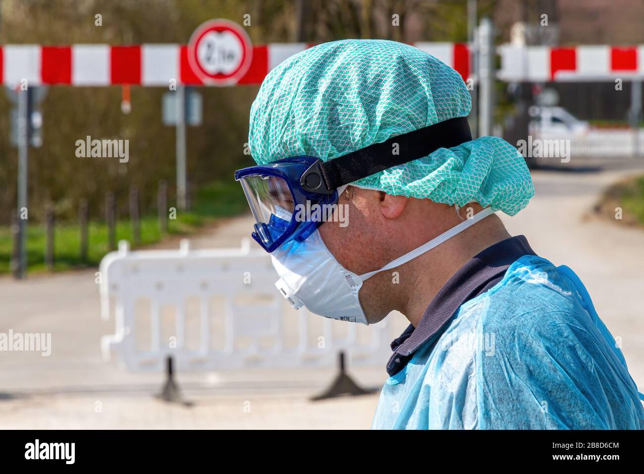 Doctor on a coronavirus test station talking with patients in their cars Stock Photo