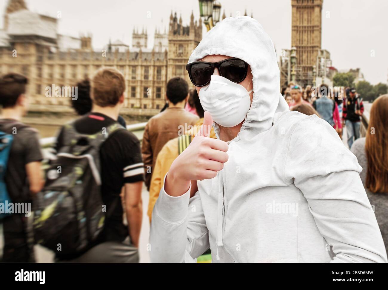 Young woman with face mask in London during coroanvirus crisis Stock Photo
