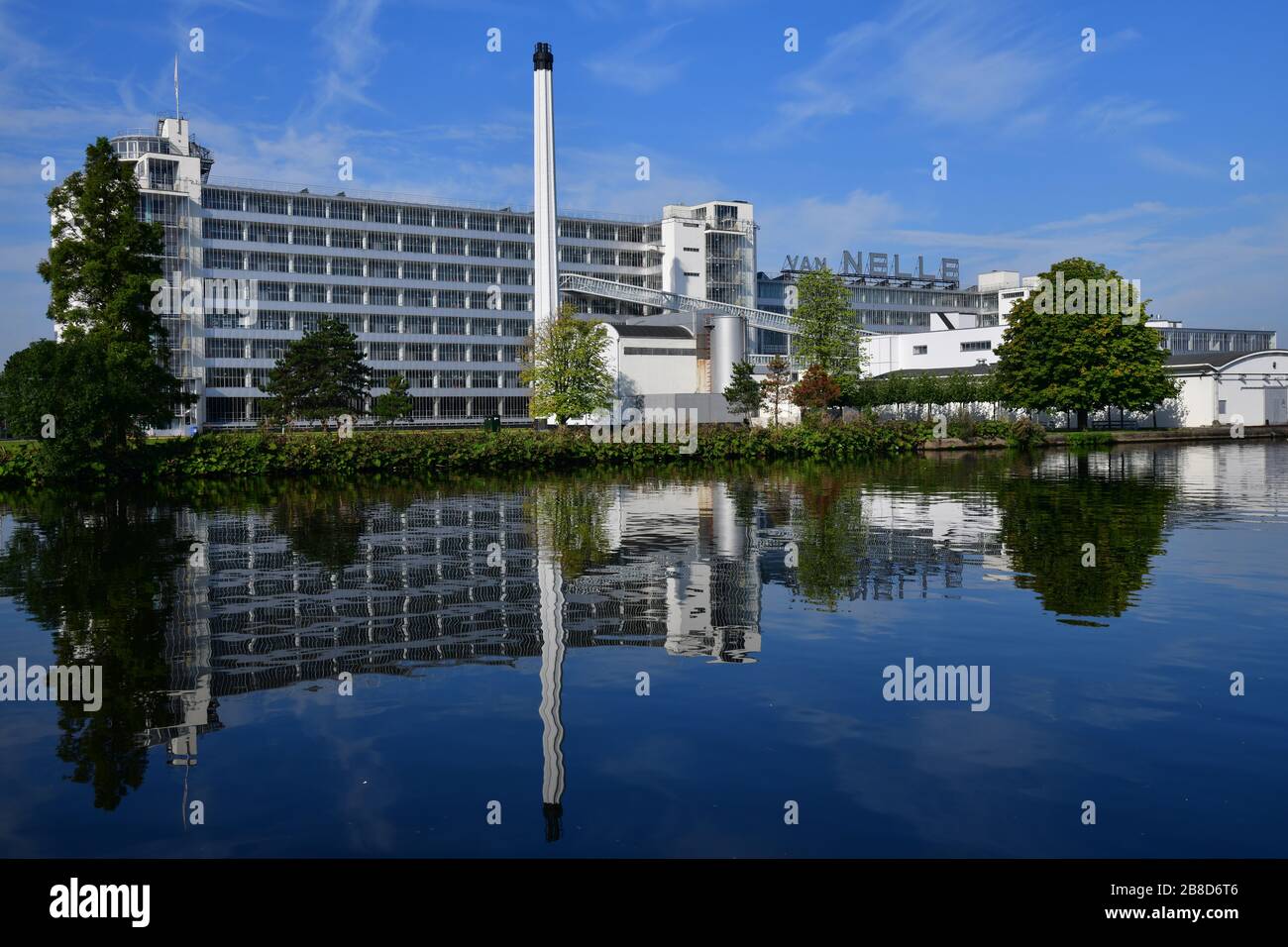 Photo taken from the other side of the Schie river of the Van Nelle Factory, a Unesco World Heritage site, reflecting in the water Stock Photo