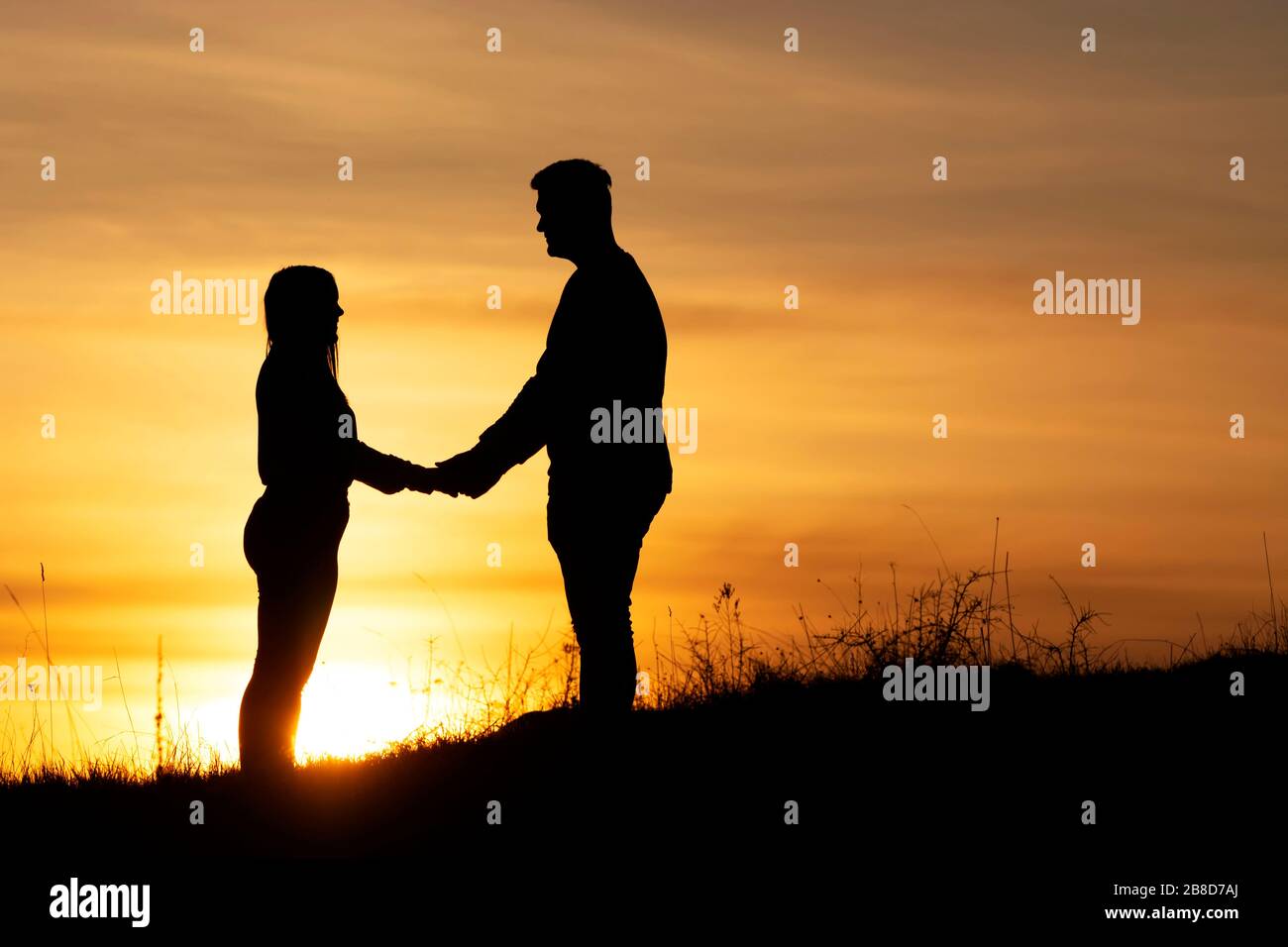 Loveing couple in sunset time in nature Stock Photo