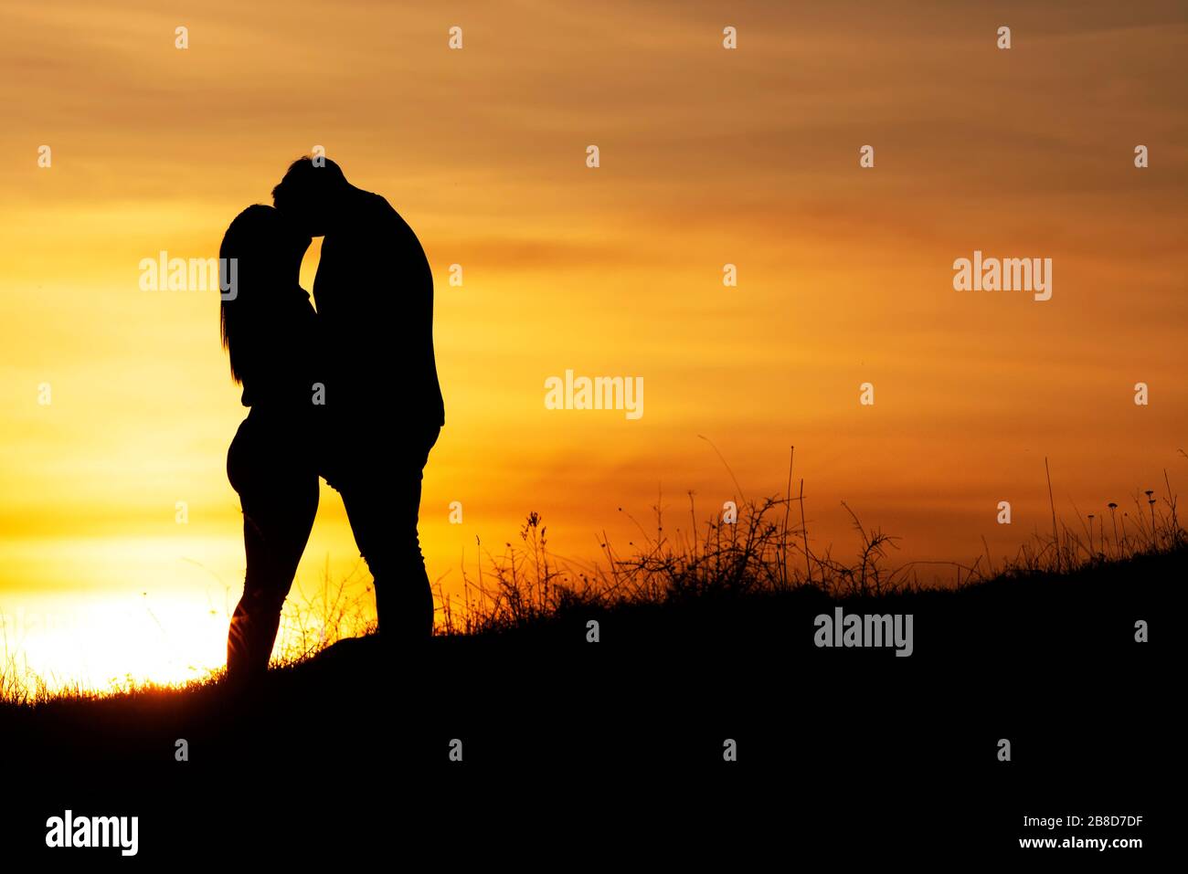 Loveing couple in sunset time in nature Stock Photo