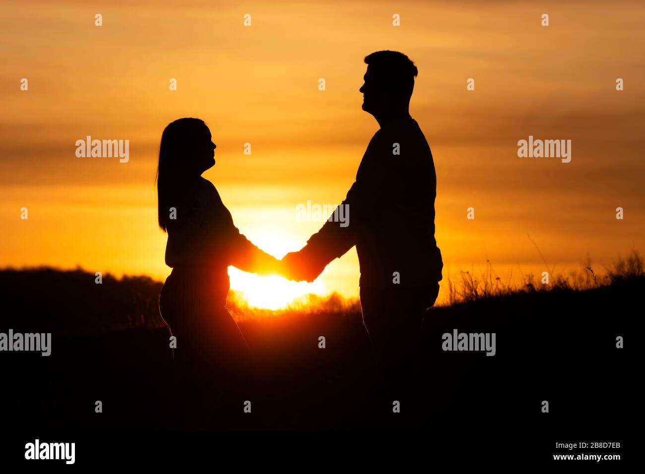 Loveing couple in sunset time in nature Stock Photo