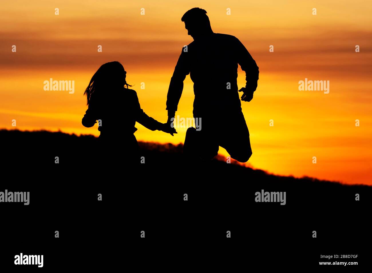 Loveing couple in sunset time in nature Stock Photo - Alamy