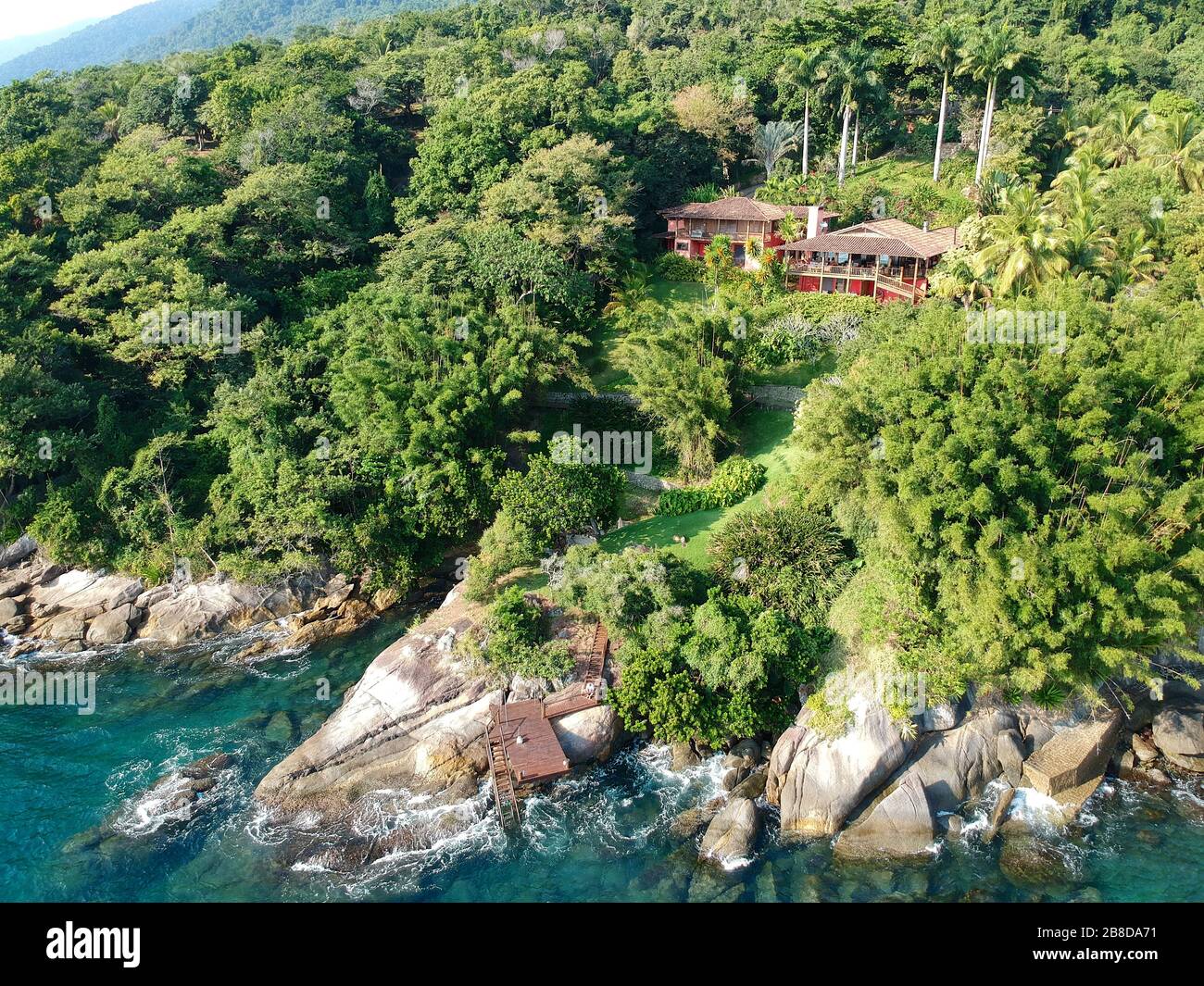 Aerial view of luxury house in tropical forest surrounded by trees and ... - Luxury Ocean View Residences With Green Walls In Brazil