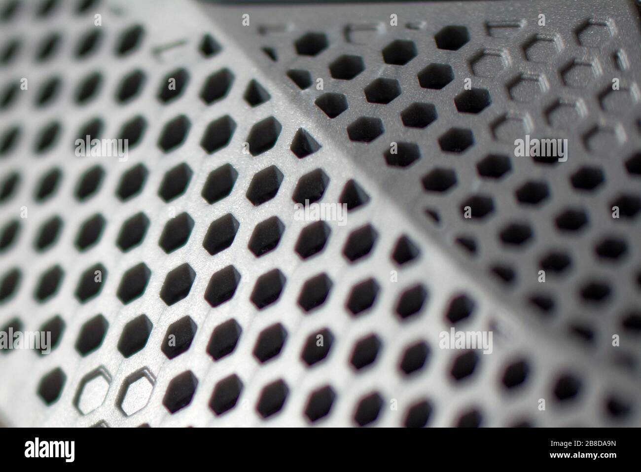 Metal perforated sheet, background with circles. Texture plastic with hole Stock Photo