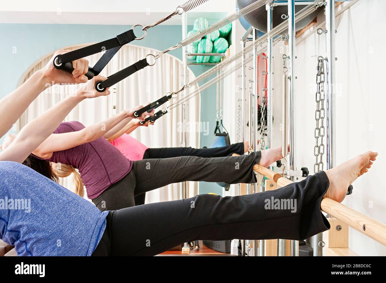Back bending in a Pilates class Stock Photo Alamy