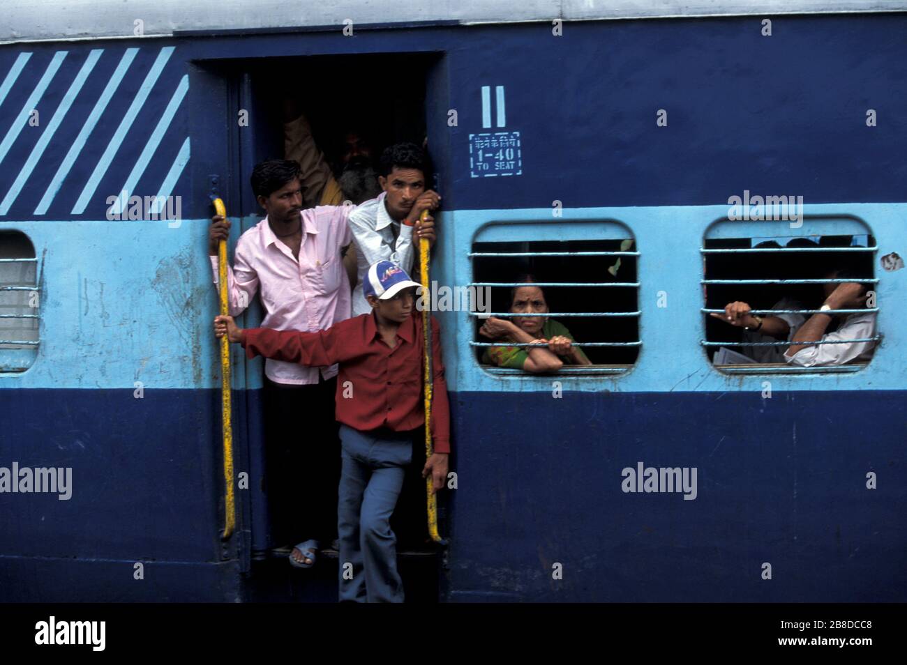Passengers in a overcrowded train in India Stock Photo