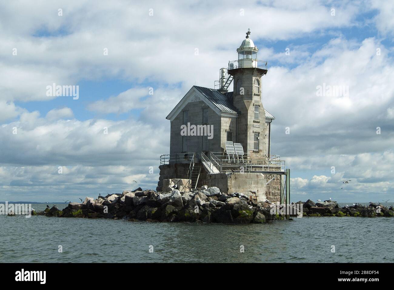 Stone architecture of Stratford Shoal (MIddleground) Lighthouse. It is believed to be haunted by a suicidal assistant keeper who attacked  worker. Stock Photo