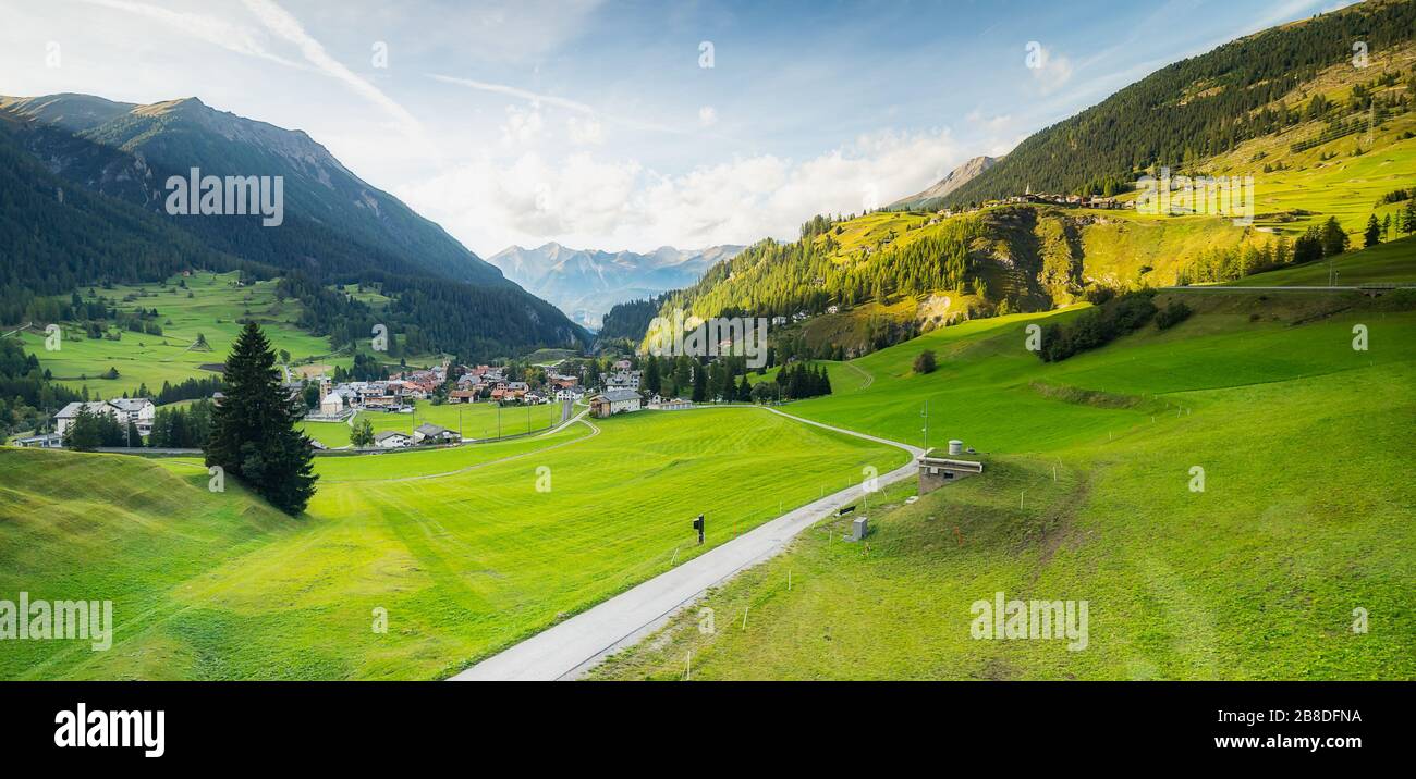 View of small Swiss village from Bernina Express which passes through the town of Privilasco (town in the Valposchiavo valley) Stock Photo