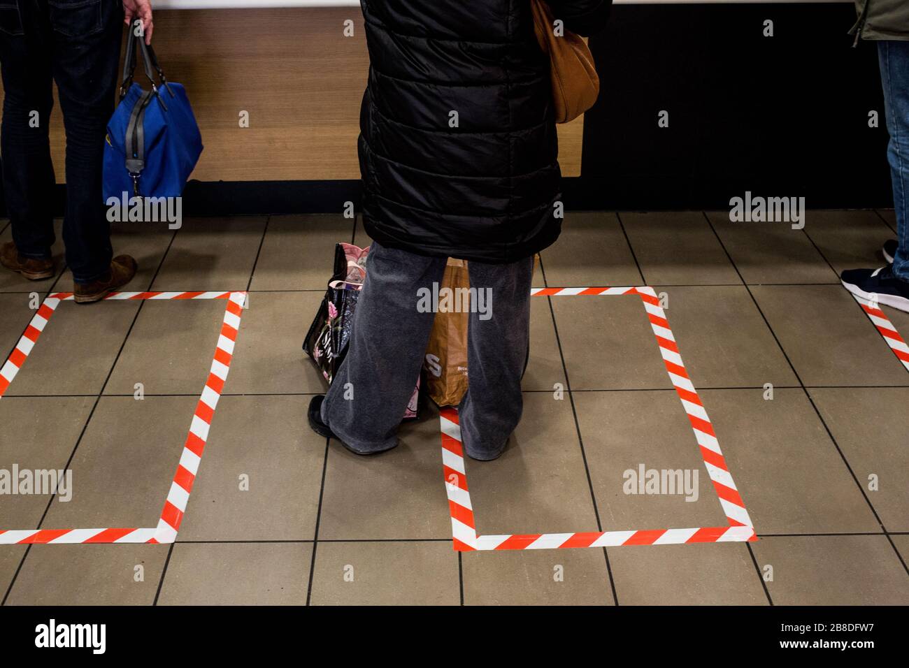 London, UK.  McDonald's store uses tape to mark where customers should stand for social distancing. Credit: Thabo Jaiyesimi/Alamy Live News Stock Photo