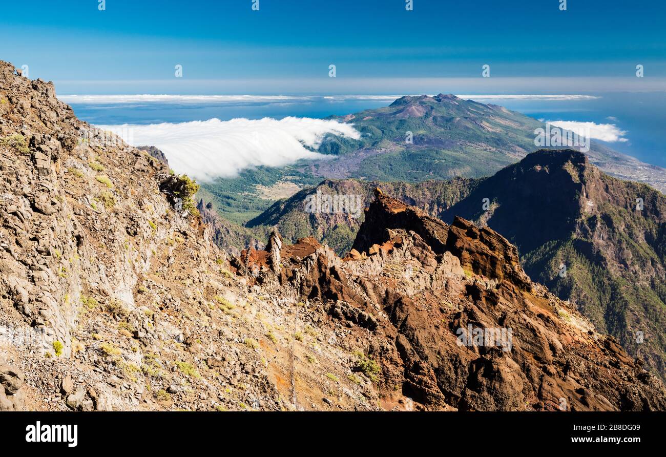 View south along Cumbre Nueva mountain ridge, La Palma, Canary Islands, towards Cumbre Vieja, from Roque de los Muchachos at almost  2,400 metres Stock Photo