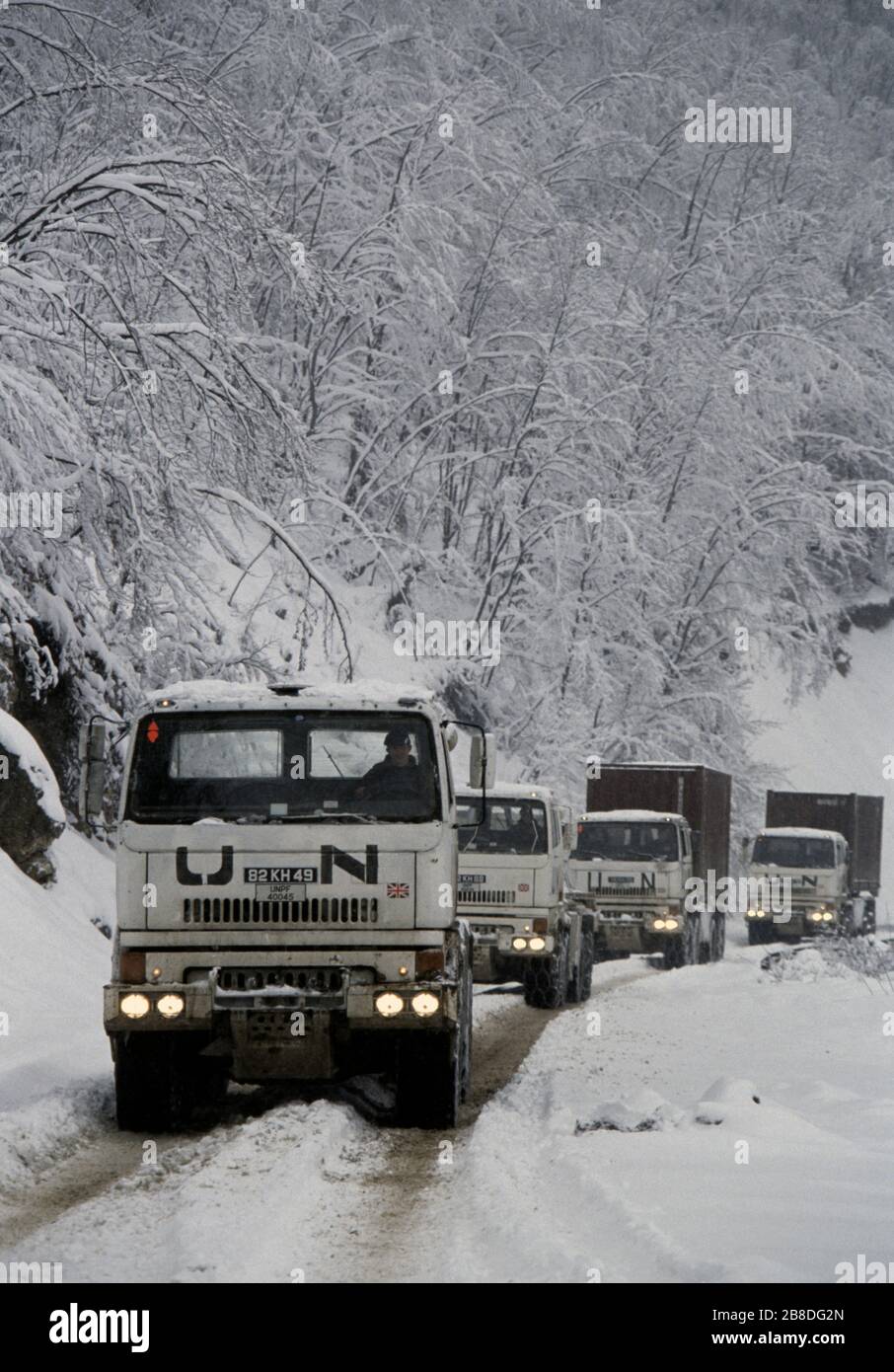 21st January 1994 During the war in central Bosnia: a convoy of British Army trucks drive north through heavy snow, along Route Diamond, just north of Gornji Vakuf. Stock Photo