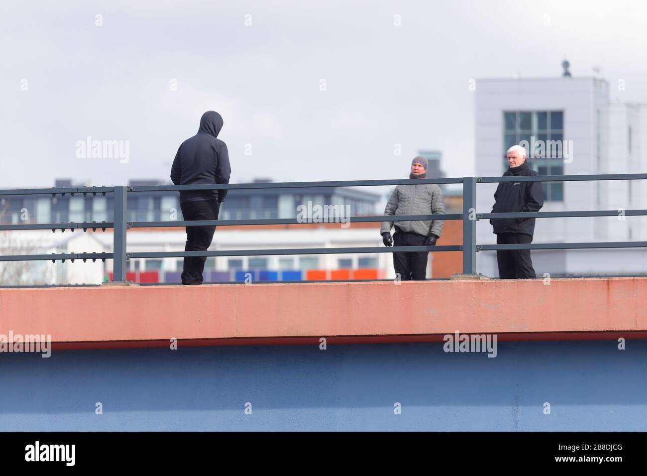 A suicidal man threatens to jump from a busy motorway bridge in Leeds, which resulted in the road being closed. The man was talked to safety. Stock Photo