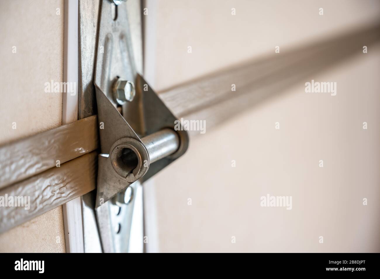 Garage door metal panel hinge Stock Photo Alamy