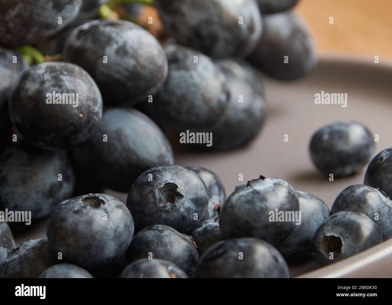 Black Grapes and Blueberries Stock Photo Alamy