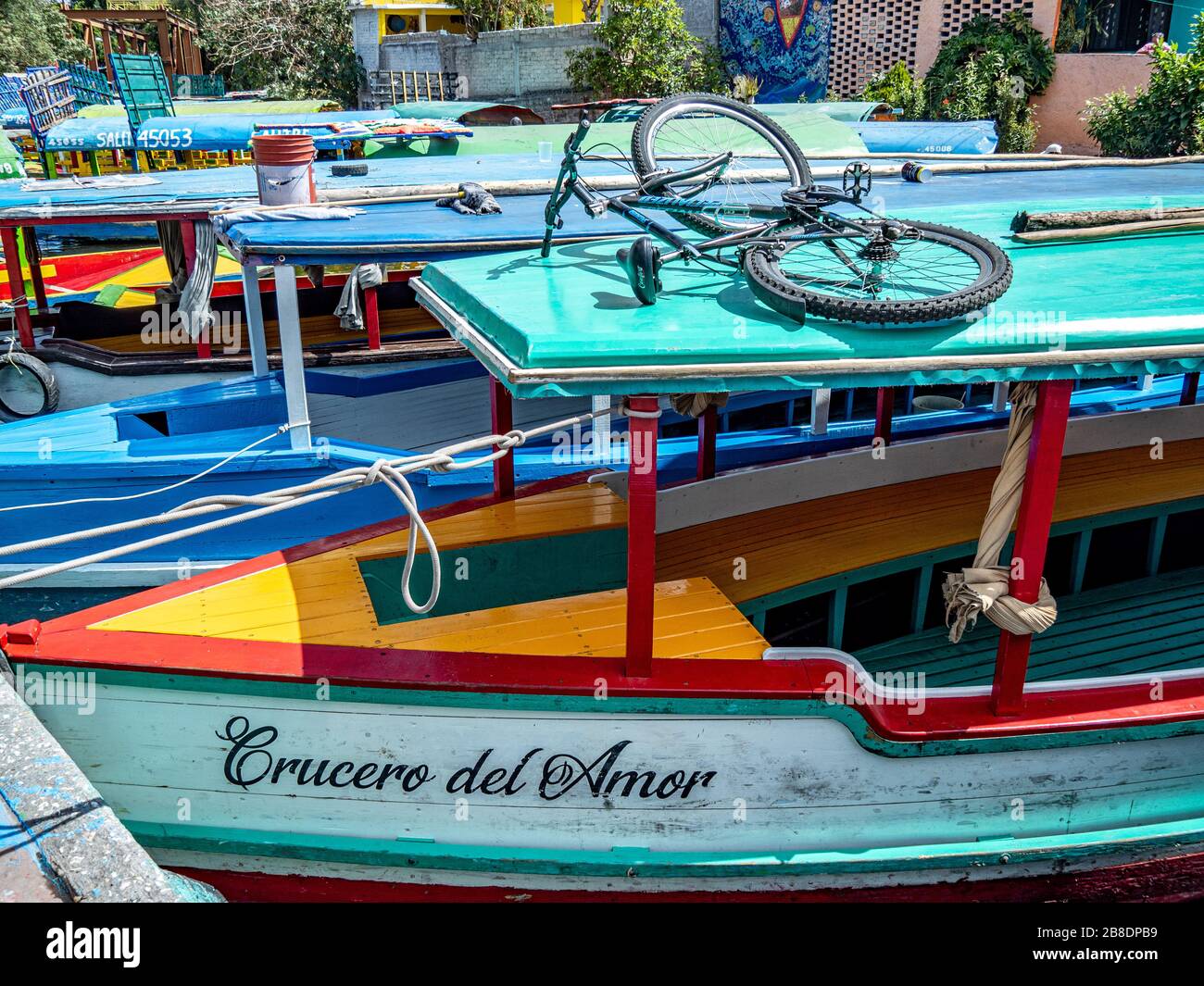 Colorful boats used by Mexicans for week-end parties on the canals of Xochimilco. Stock Photo