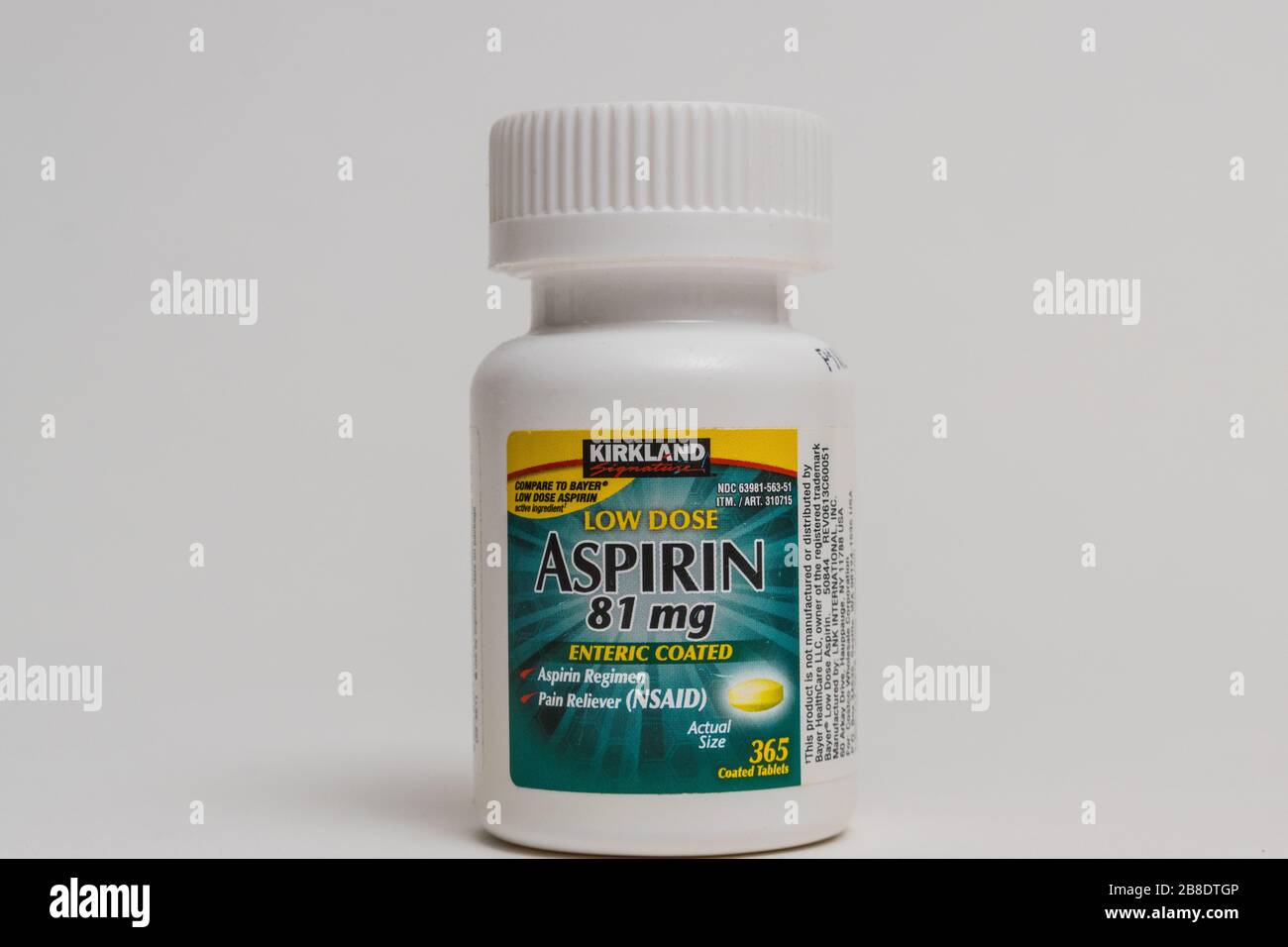 A bottle of Kirkland brand from Costco low dose aspirin used to reduce the risk of Heart Attack Stock Photo