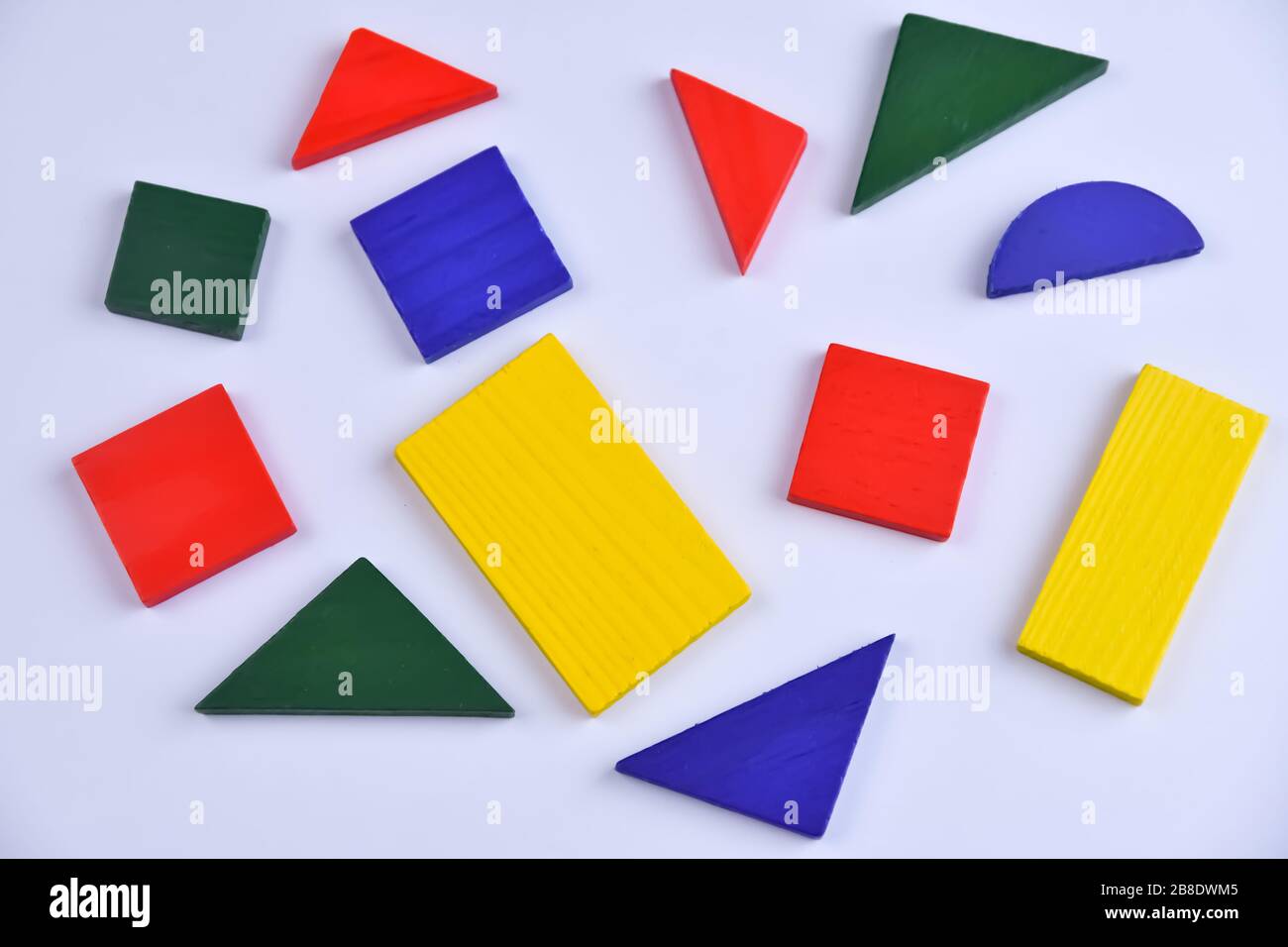 Bright multicolored wooden constructor details for children for the development and education on a white background Stock Photo