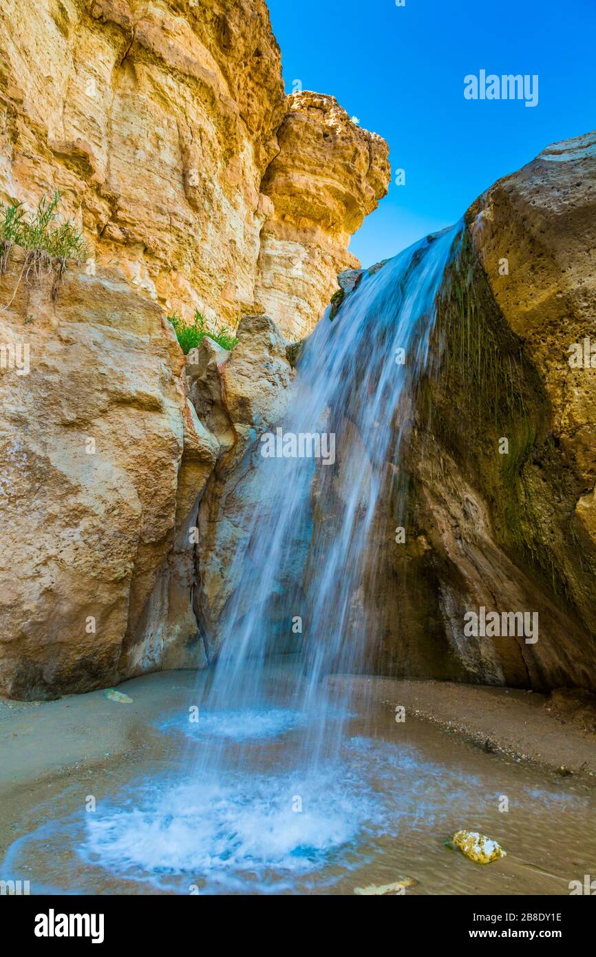 Waterfall in mountain oasis. Stock Photo