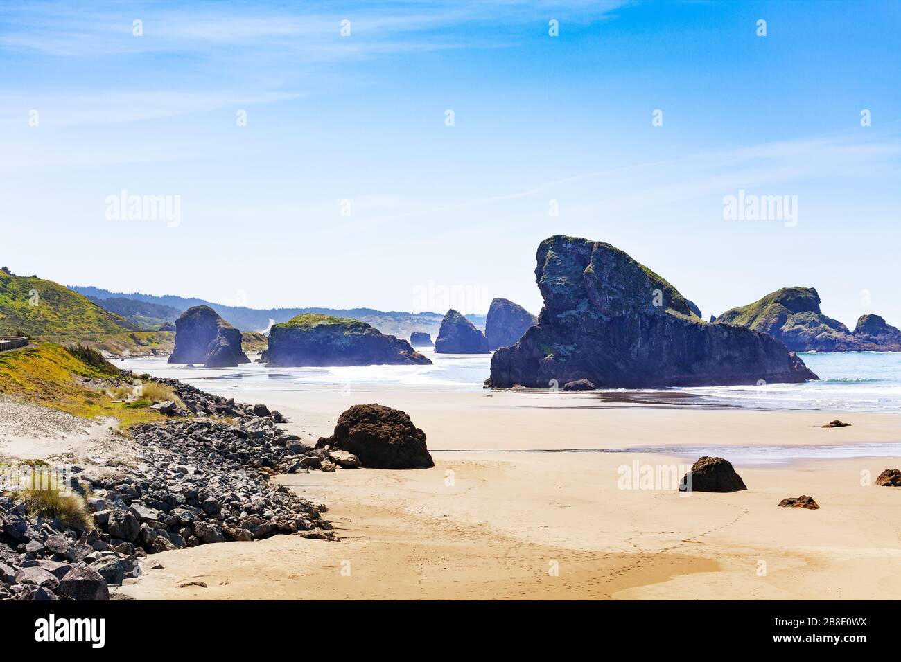 Sand and waves on Gold Beach near Cave Rock on Pacific ocean west coast, Oregon Stock Photo