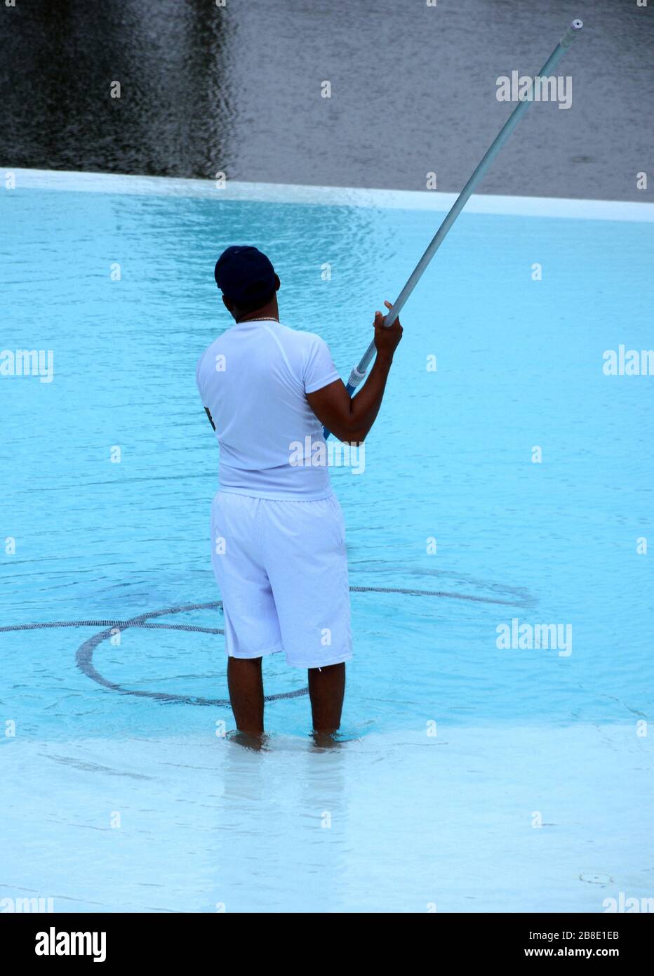 Pool attendant at a hotel in the Dominican Republic Stock Photo