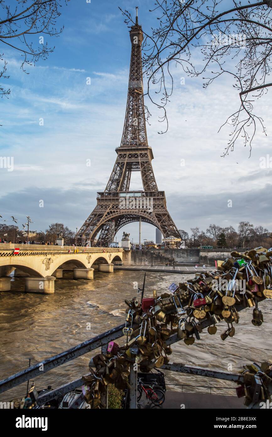 View on the famous paris eiffel tower from the promenade of the Seine . Stock Photo