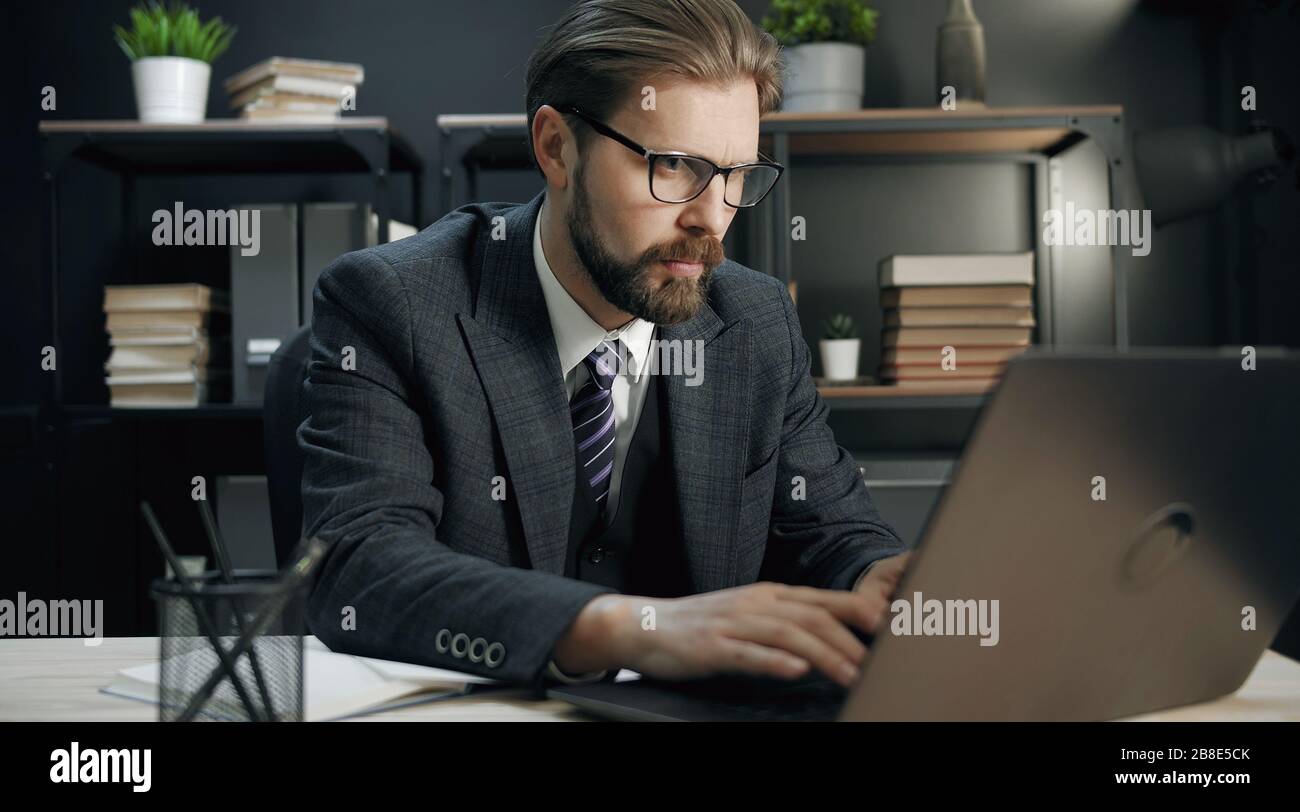 Middle-aged businessman working on computer Stock Photo
