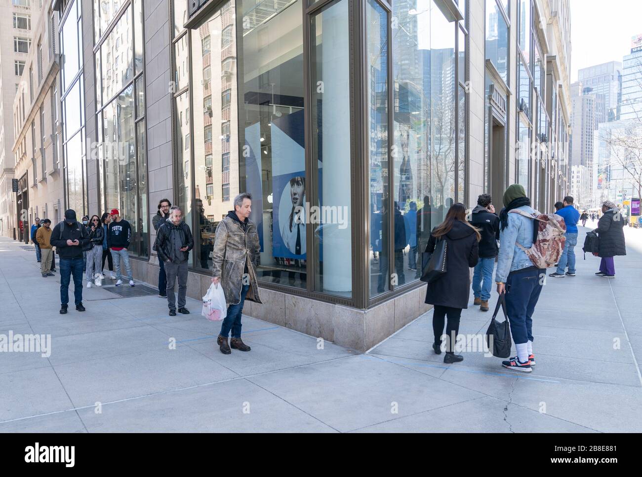 New York, NY - March 21, 2020: Customers maintain social distances of 6 feet at Best Buy electronic store on Broadway Stock Photo