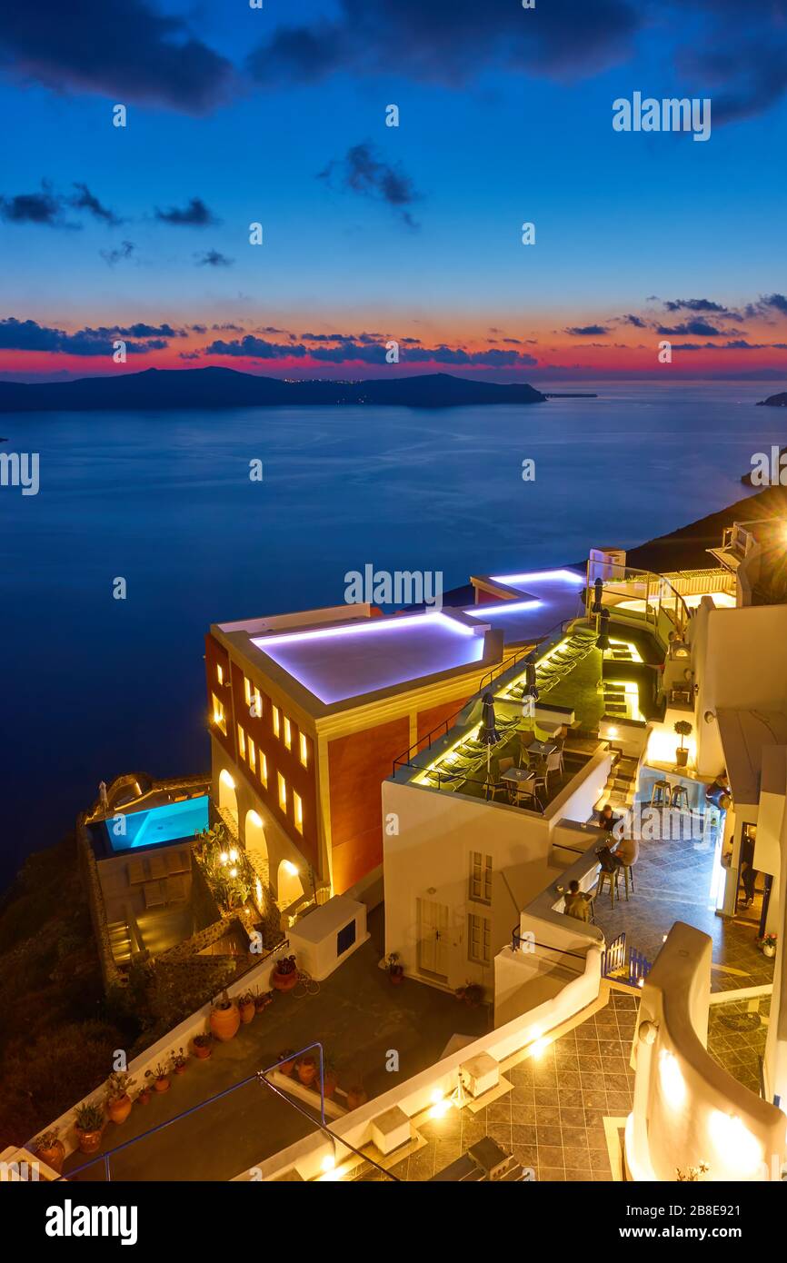 Lghts of bars and hotels in Santorini Island and Aegean Sea at twilight, Greece. Greek landscape - cityscape Stock Photo