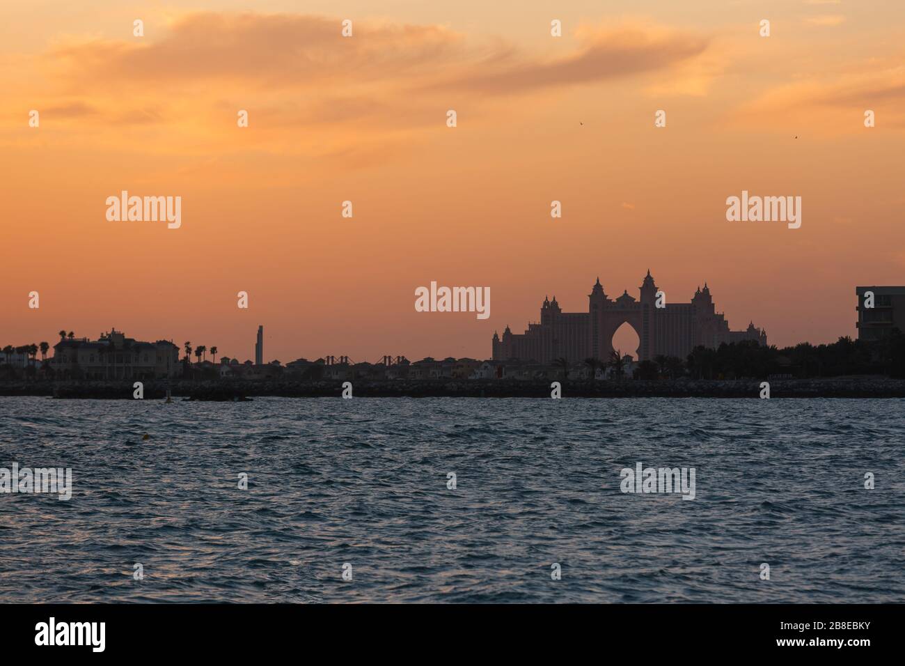 silhouette of the building on the sea shore sunset Stock Photo - Alamy