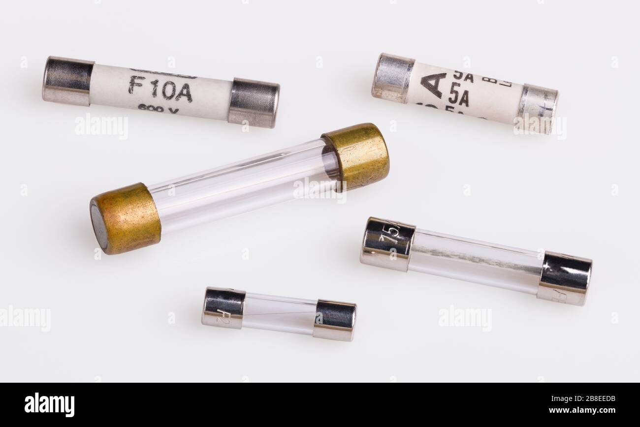 Set of miniature electrical fuses for overcurrent protection. Safety electronic components group. Metal fusible wire or strip in ceramic or glass tube. Stock Photo