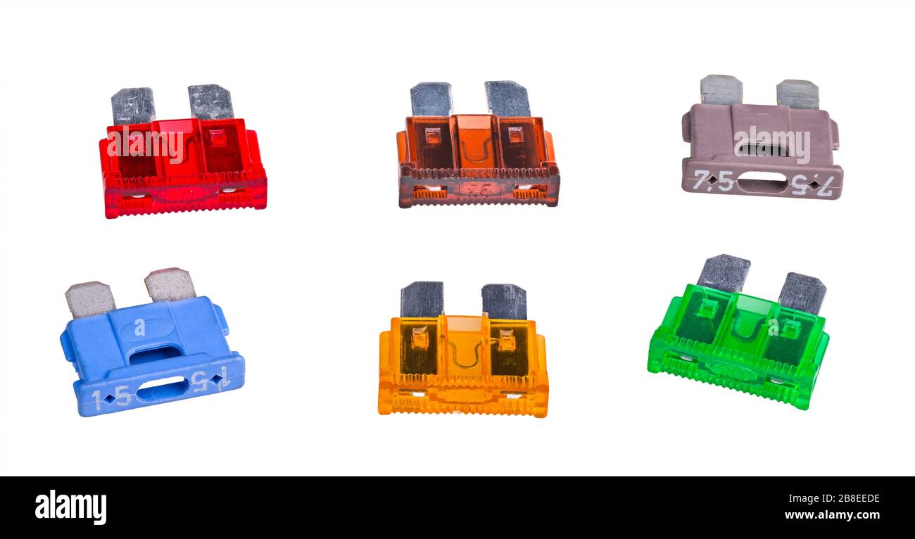 Set of automotive blade type fuses with two metal prongs. Group of colored plastic overcurrent protectors with rated current in amperes. Used in cars. Stock Photo