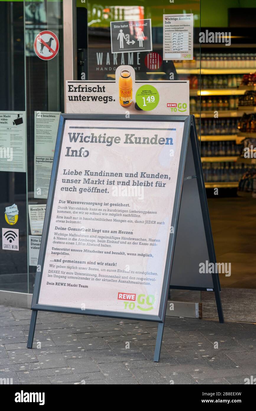 Effects of the coronavirus crisis, empty shopping street, notice at a food market, Hohe Strasse in Cologne, Germany, Stock Photo