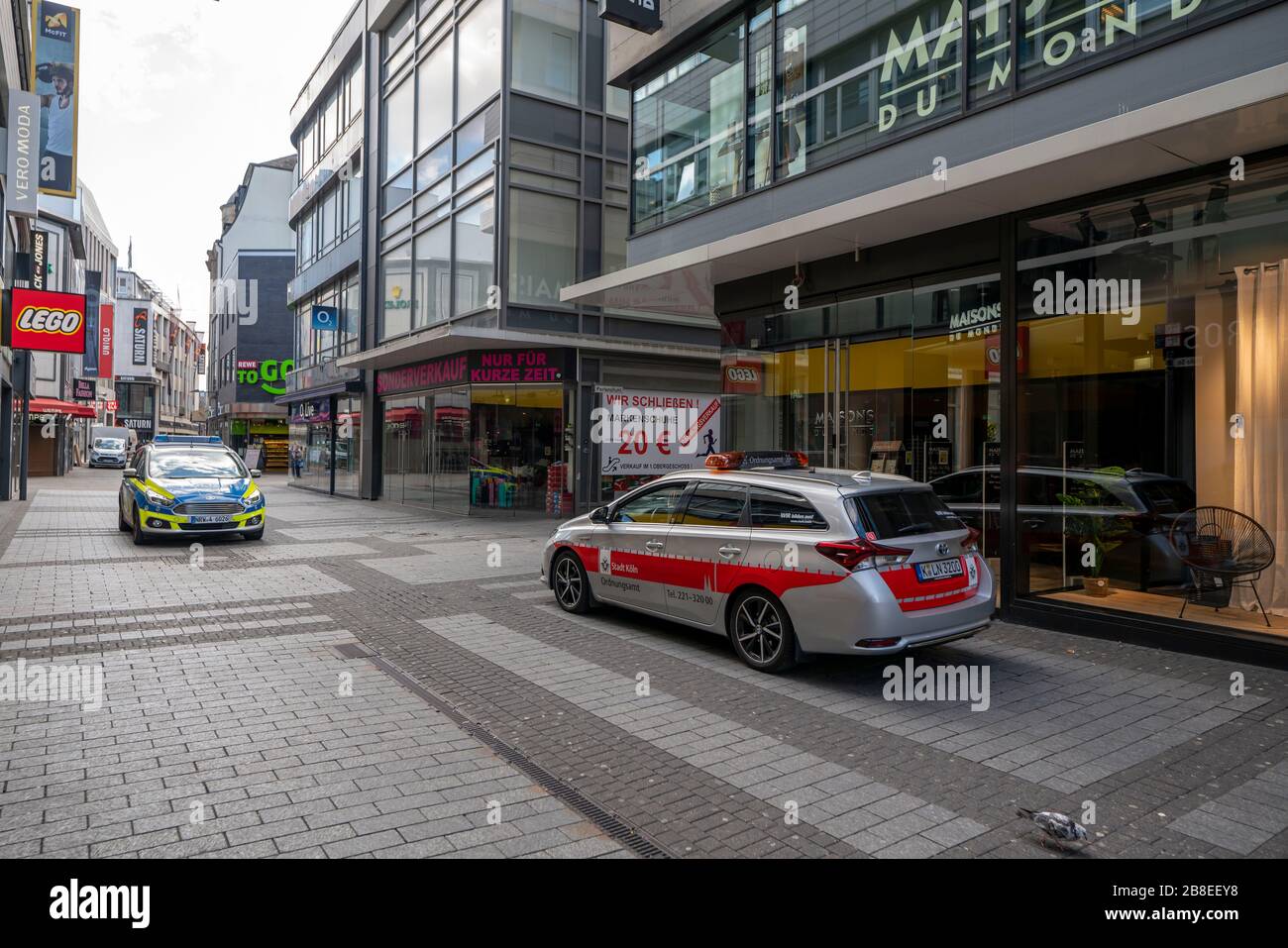 Effects of the coronavirus crisis, empty shopping street, patrol of the public order office and police, around 1400 hours on Saturday, normally thousa Stock Photo