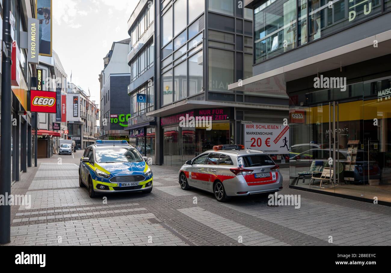 Effects of the coronavirus crisis, empty shopping street, patrol of the public order office and police, around 1400 hours on Saturday, normally thousa Stock Photo