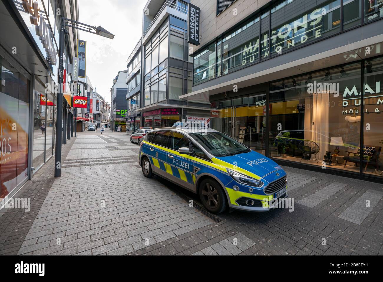 Effects of the coronavirus crisis, empty shopping street, patrol of the public order office and police, around 1400 hours on Saturday, normally thousa Stock Photo