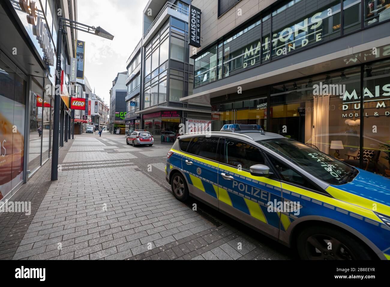 Effects of the coronavirus crisis, empty shopping street, patrol of the public order office and police, around 1400 hours on Saturday, normally thousa Stock Photo