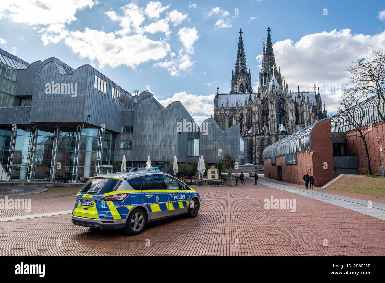 Effects of the coronavirus crisis, empty shopping street, police patrol car, Cologne Cathedral, Heinrich-Bšll-Platz, in Cologne, Germany Stock Photo