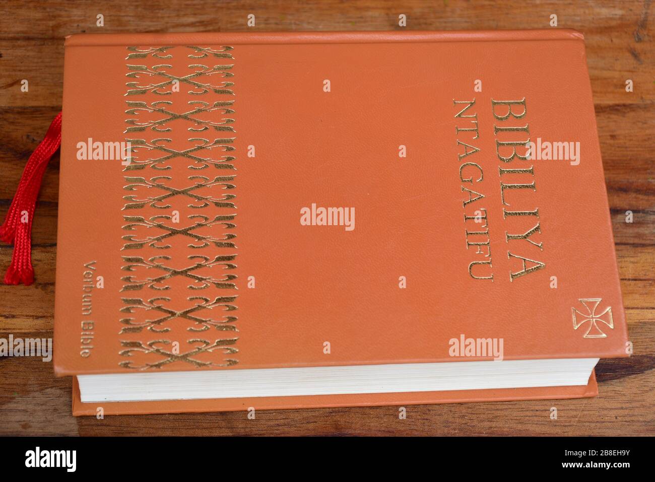 Kinyarwanda language Catholic Holy Bible on wooden table Stock Photo