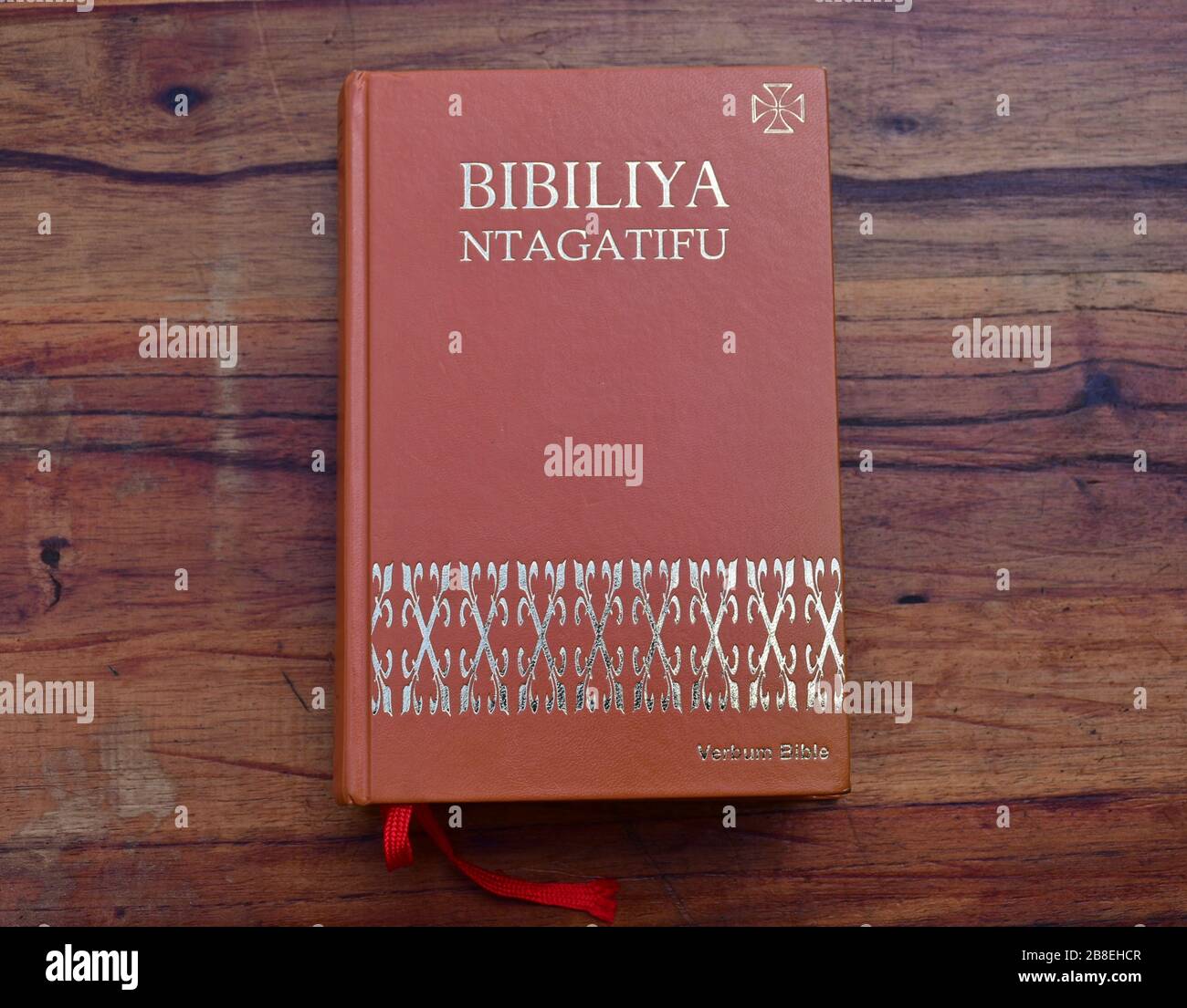 Kinyarwanda language Catholic Holy Bible on wooden table Stock Photo