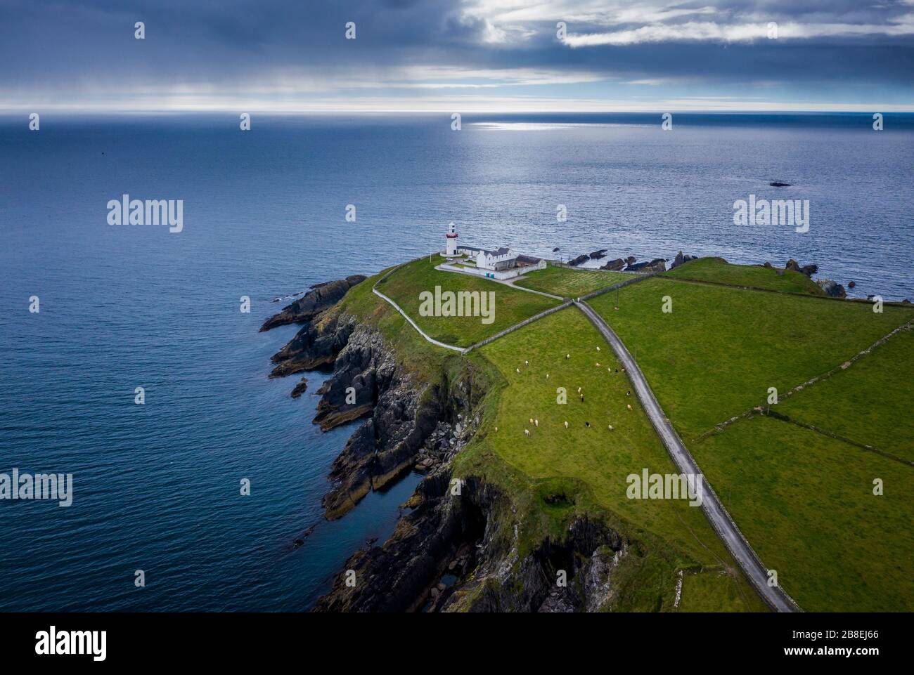 Galley Head Lighthouse is an active 19th century lighthouse outside of Rosscarbery, County Cork, on the south coast of Ireland. Stock Photo