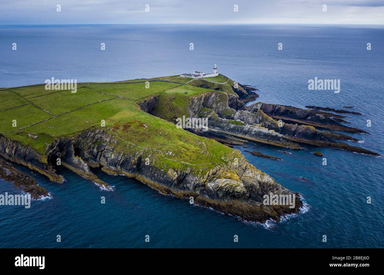 Galley Head Lighthouse is an active 19th century lighthouse outside of Rosscarbery, County Cork, on the south coast of Ireland. Stock Photo