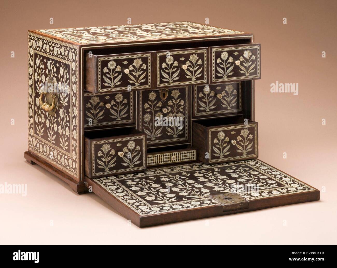 'Fall-Front Cabinet (image 16 of 22); English:  India, Gujarat or Pakistan, Sindh, circa 1650-1670 Furnishings; Furniture Rosewood inlaid with ivory; brass fittings 15 1/8 x 21 3/4 x 16 in. (38.42 x 55.25 x 40.64 cm) Purchased with funds provided by Jane and Marc Nathanson, Bill and Dee Grinnell, Greg and Mechas Grinnell, and Marilyn B. and Calvin B. Gross through the 2007 Collectors Committee (M.2007.56) South and Southeast Asian Art Currently on public view: Ahmanson Building, floor 4; between circa 1650 and circa 1670 date QS:P571,+1650-00-00T00:00:00Z/7,P1319,+1650-00-00T00:00:00Z/9,P1326, Stock Photo